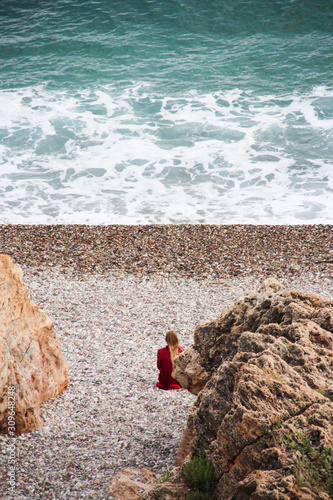 red girl on the beach photo