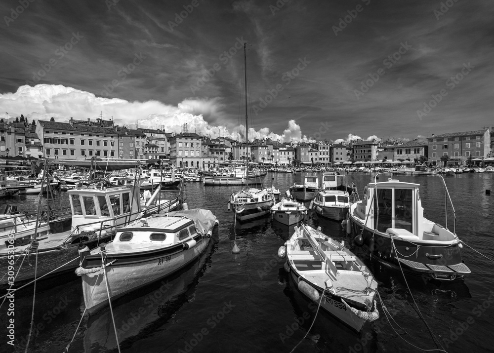 Embankment with boats of the city of Rovinj. Mediterranean Sea Rovinj Old Town. Croatia. Black white