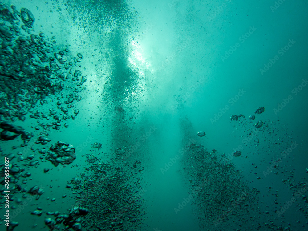 Underwater bubbles rising to the surface
