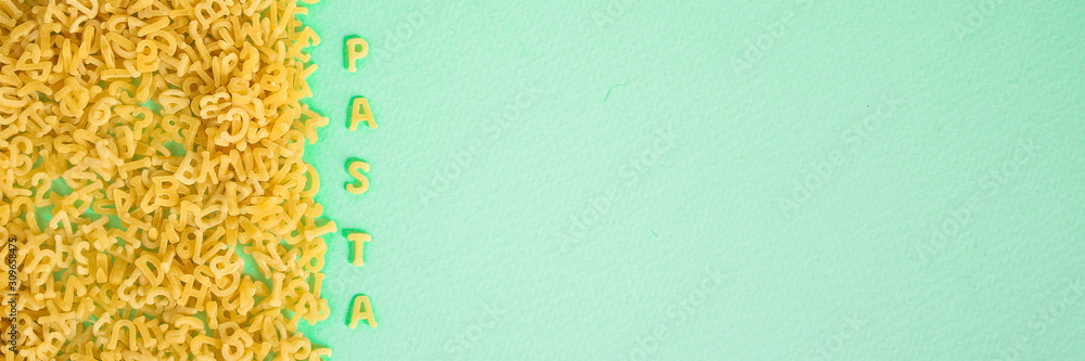 Obraz premium Pasta Alphabet (set of ingredients, raw pasta) serving second course. top food background. copy space