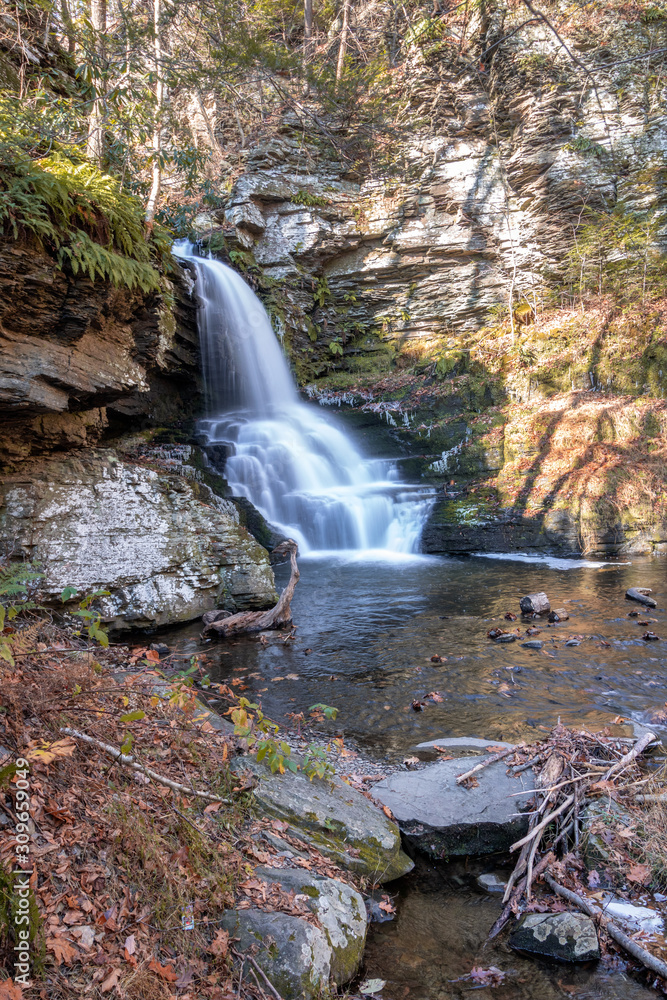 Beautiful waterfall cascading down rocks at Bushkill Falls. The 
