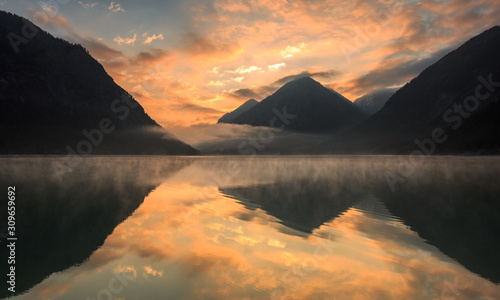 Heiterwanger See zum farbenprächtigen Sonnenaufgang mit Nebel / Lake Heiterwang at sunrise with fog photo