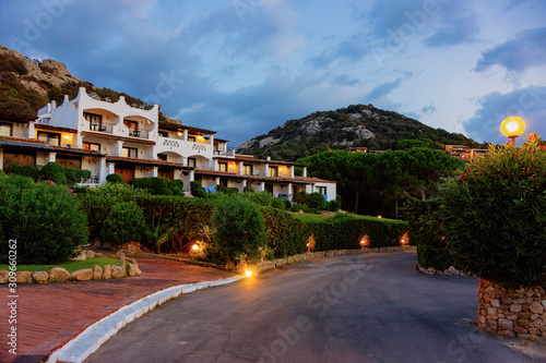 Houses at Baja Sardinia luxury resort at night on Sardinia