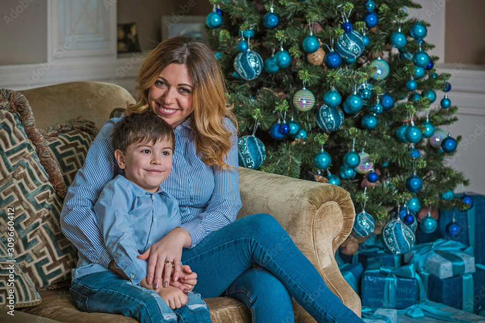 Nice mom and little boy at Christmas time, children and parents lifestyle