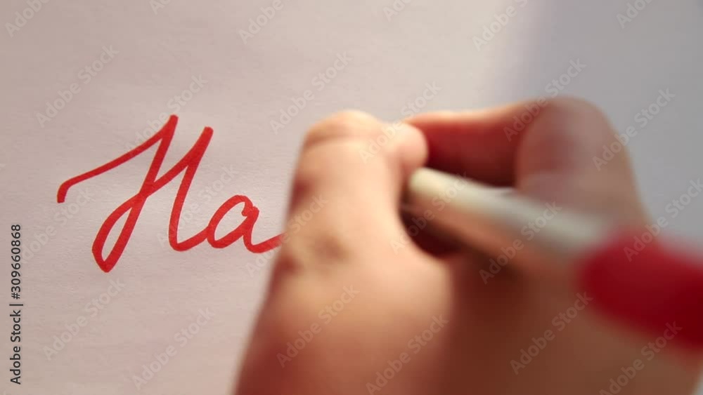 Hand writing Happy on white paper Hand writing Happy on white paper