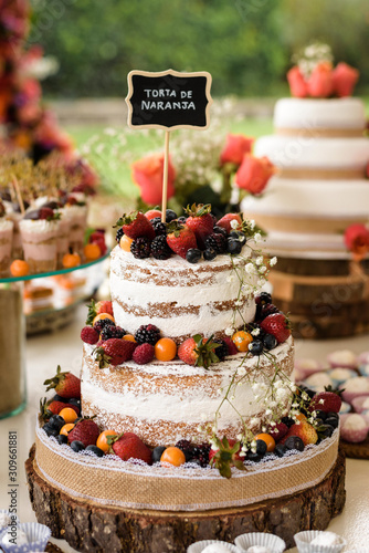 fruit wedding cake with different berrys front view