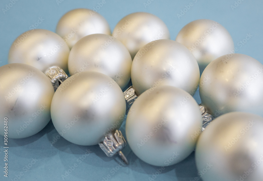 Christmas or new year flat lay with white balls on light blue background. Top view. Christmas or new year flat lay with white balls on light blue background. Top view.