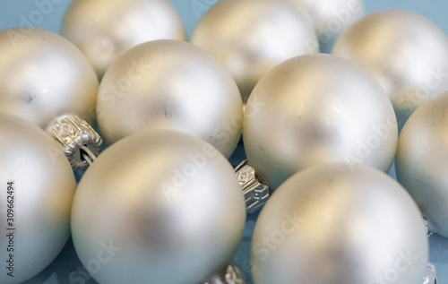 Christmas or new year flat lay with white balls on light blue background. Top view. 