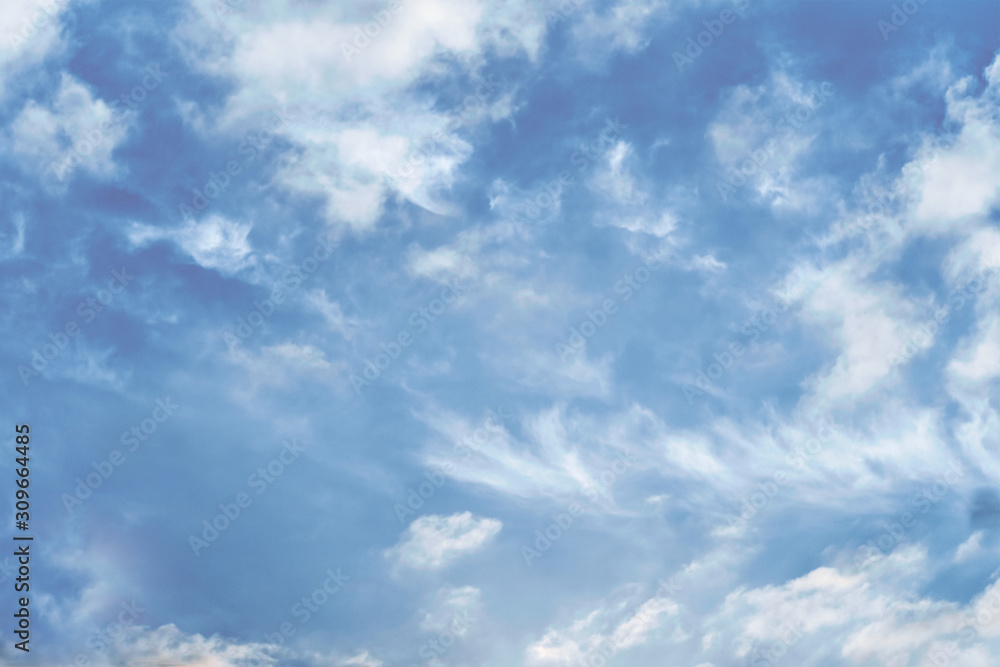 Blue sky and white clouds blur background. 