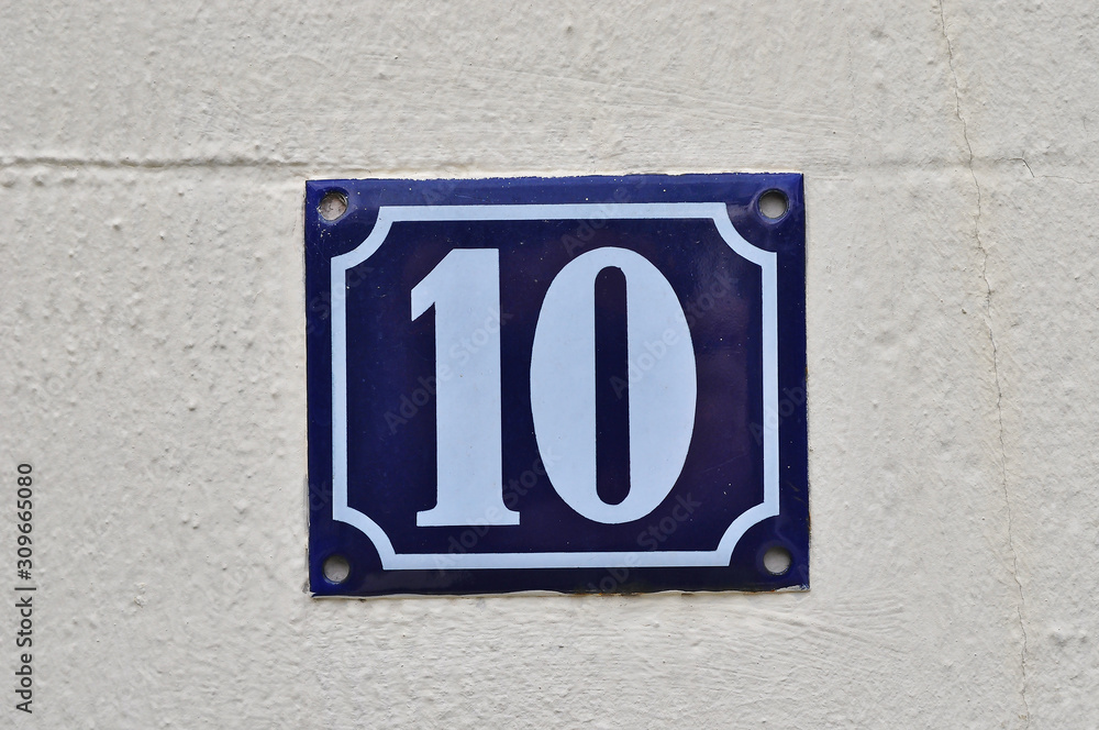 A house number plaque, showing the number ten (10) A house number plaque, showing the number ten (10)