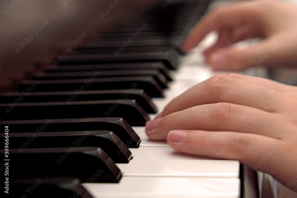 Obraz premium Boy and Grandfather playing piano