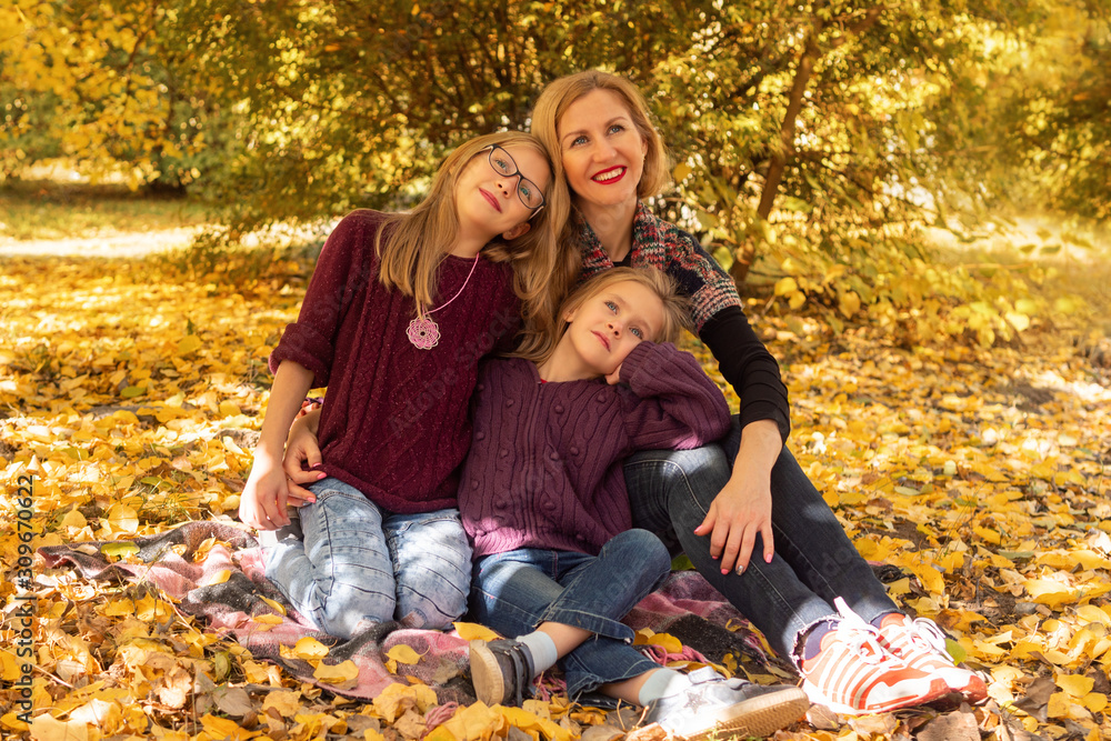 autumn portrait of mother with daughters autumn portrait of mother with daughters
