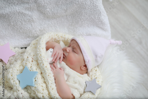 Baby newborn sleeping wrapped up in a blanket