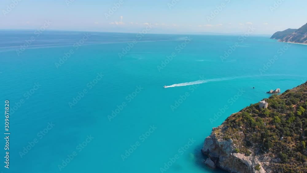 Aerial view of beautiful blue water and boat on paradise island Lefkada in Greece Aerial view of beautiful blue water and boat on paradise island Lefkada in Greece
