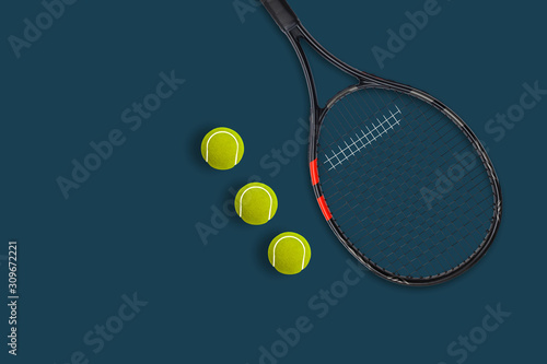 Tennis racket balls on blue background © Angelov