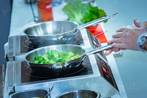 Cook roasting broccoli. Lea...