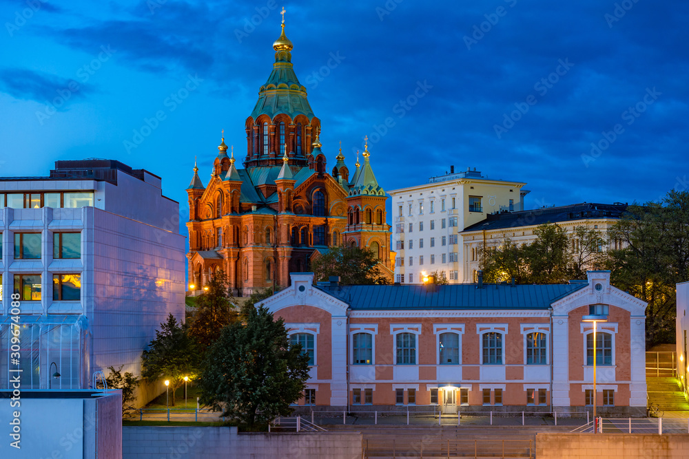 Obraz premium Helsinki. Finland. Evening capital of Finland. The Waterfront Of Helsinki. Assumption Cathedral in Helsinki. Scandinavia. A Church with green domes against the evening sky. Summer trip to Finland.