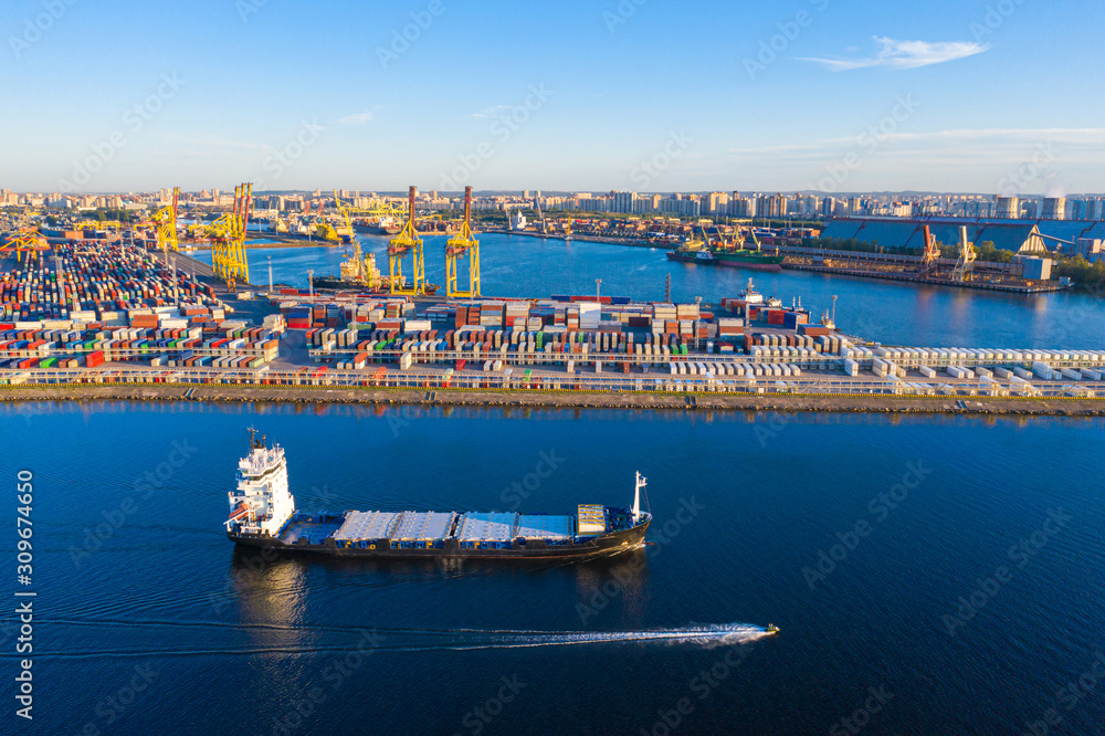 Helsinki. Finland. Barge is sailing a cargo port. Trading port in Helsinki. Cargo delivery to Finland by sea. Barge arrived to load. Imports of goods to Finland. Export and the European Union. Ship