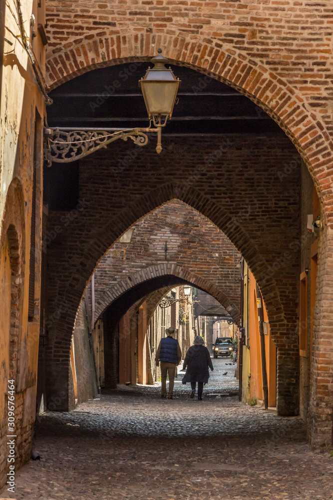 A walk in the old center of Ferrara, Italy