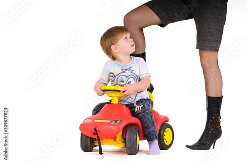 A boy is played with toy cars on isolated white background