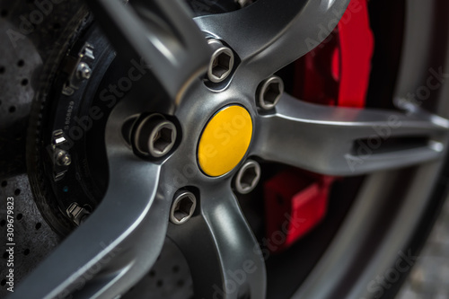 Detail on a wonderful sport's car wheel with yellow breaks © Atmosphere