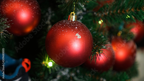 Christmas decorations on the Christmas tree. Red ball.