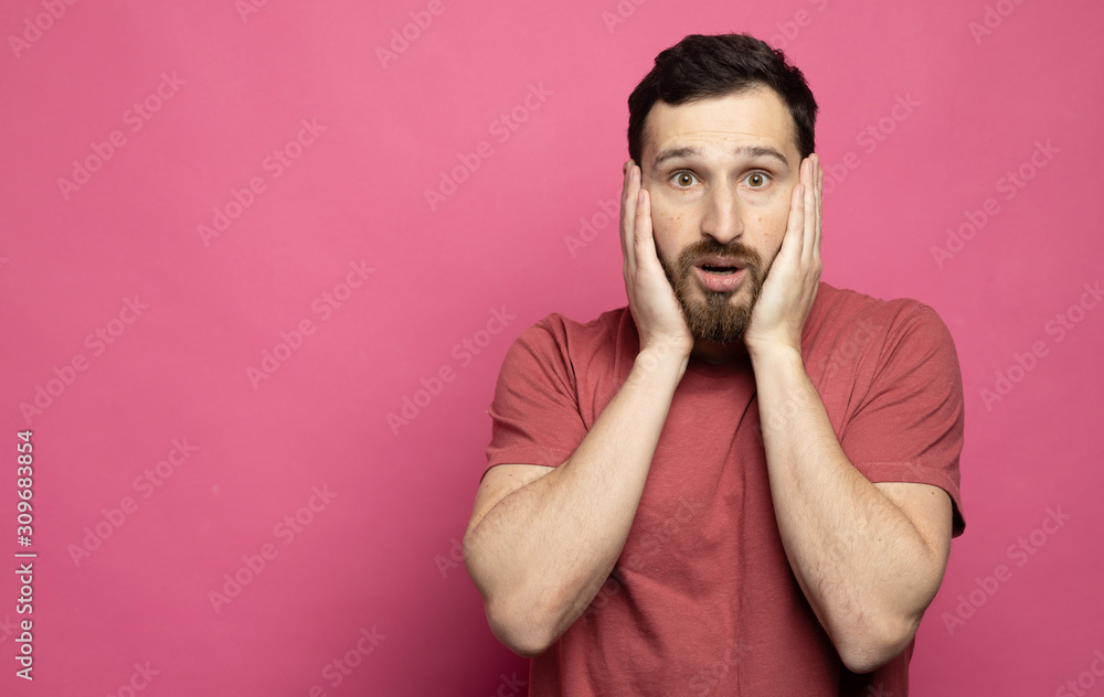 Bearded Man with shocked, amazed expression isolated on pink background Bearded Man with shocked, amazed expression isolated on pink background