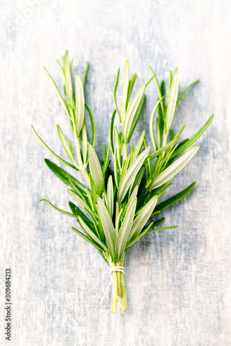 Wallpaper Mural Fresh rosemary on rustic wooden background. Top view.  Torontodigital.ca