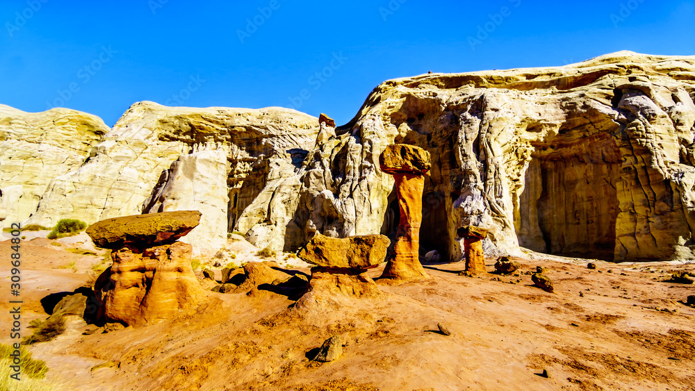 Toadstool Hoodoos against the background of the colorful sandstone mountains in Grand Staircase-Escalante Monument in Utah, Unites States