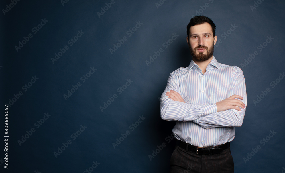Casual businessman with arms crossed on blue background. Casual businessman with arms crossed on blue background.