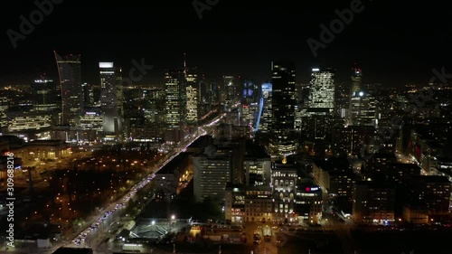 Wallpaper Mural Aerial view of the night city with skyscrapers and busy streets with traffic jams during rush hour. Warsaw, Poland. 13. December. 2019. Drone shot at night metropolis with skyscrapers and buildings. Torontodigital.ca