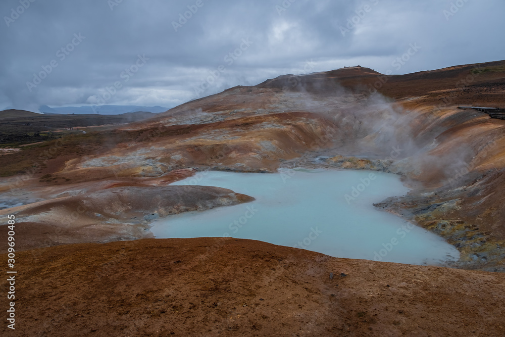 Exotic landscape of Acid hot lake with turquoise water in the geothermal valley Leirhnjukur. Location: valley Leirhnjukur, Myvatn region, North part of Iceland, Europe. September 2019