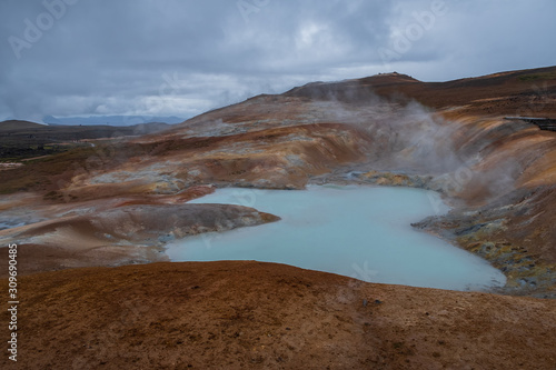 Exotic landscape of Acid hot lake with turquoise water in the geothermal valley Leirhnjukur. Location: valley Leirhnjukur, Myvatn region, North part of Iceland, Europe. September 2019