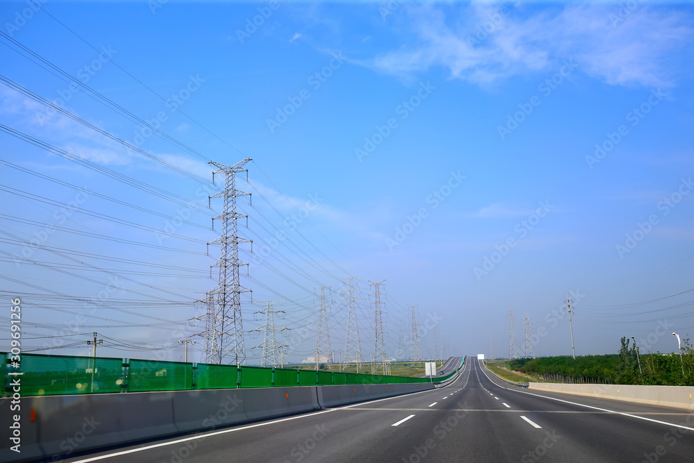 Beautiful highway, under the blue sky and white clouds