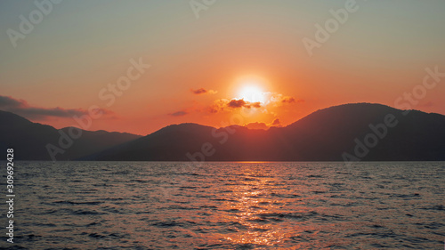 Pink sunset in the sea, gentle romantic natural background.