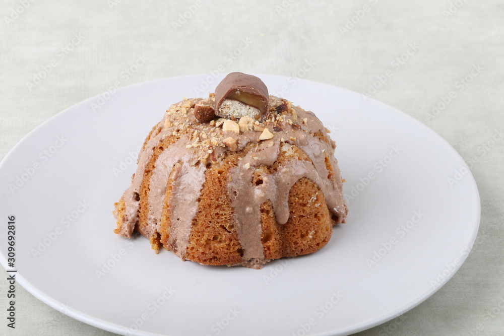 cake on a white plate on a texture background cake on a white plate on a texture background