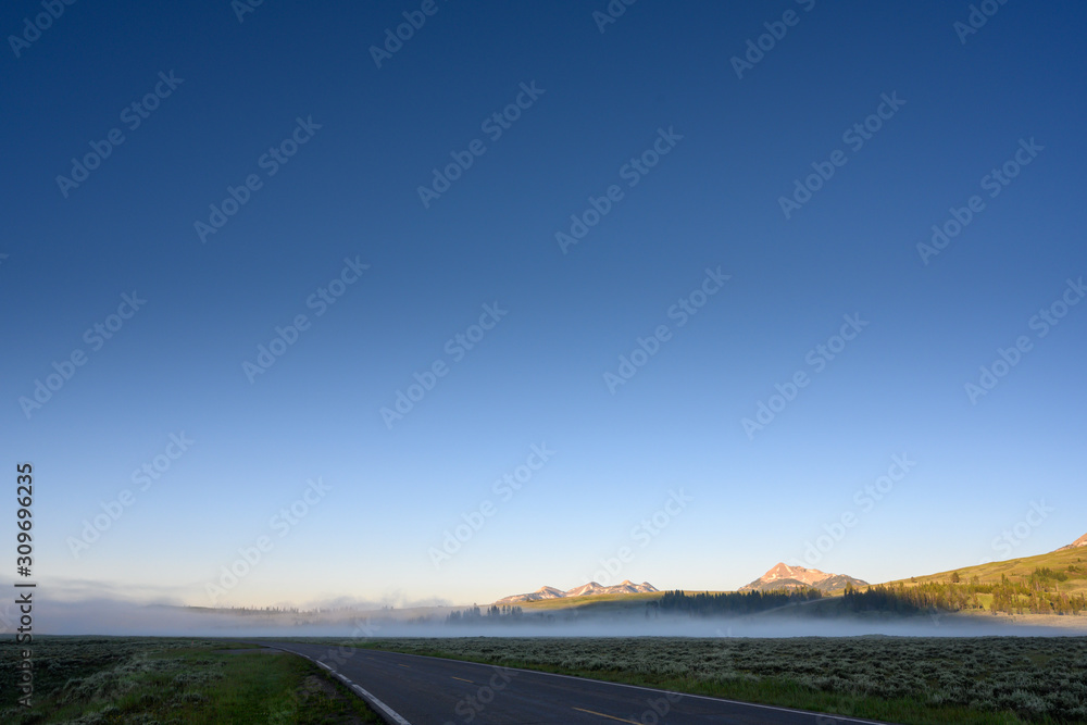 Fototapeta premium Fog Wafting Across Yellowstone Field