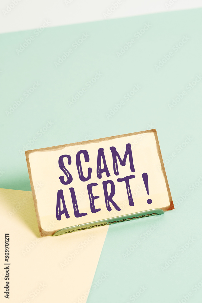 Text sign showing Scam Alert. Business photo showcasing fraudulently obtain money from victim by persuading him Paper placed tilted above buffer wire on soft pastel multi colours backdrop Text sign showing Scam Alert. Business photo showcasing fraudulently obtain money from victim by persuading him Paper placed tilted above buffer wire on soft pastel multi colours backdrop