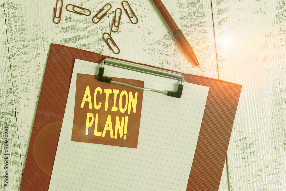 Fototapeta premium Word writing text Action Plan. Business photo showcasing proposed strategy or course of actions for certain time Clipboard paper sheet sticky note ballpoint clips vintage wooden background