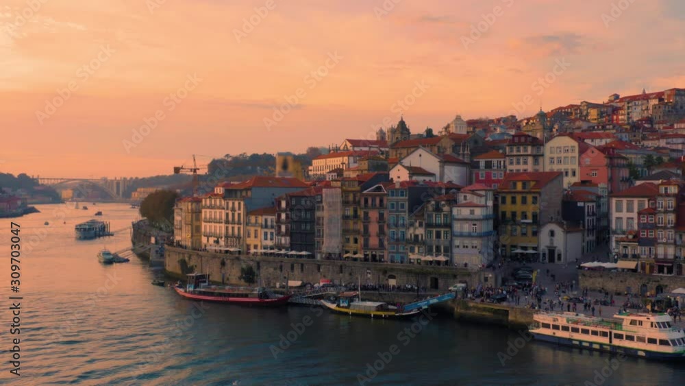 Porto, Portugal. Aerial view of the old city with promenade of the Douro river at sunset Porto, Portugal. Aerial view of the old city with promenade of the Douro river at sunset