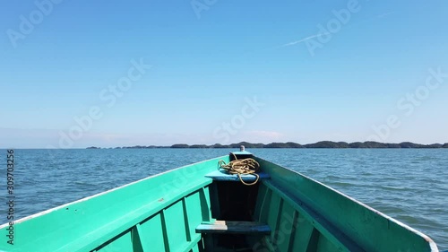 Sailing around the Hundred Islands in a Bangka Boat in the Summer Season, located in Alaminos, Pangasinan, Zambales, in the Philippines photo