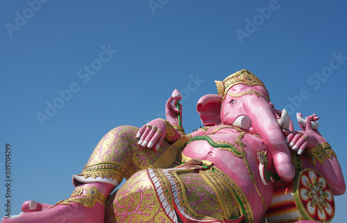 Chachoengsao,Thailand-December 5, 2019: Statue of Pink Ganesha,Hindu god of wisdom or prophecy, on blue sky background