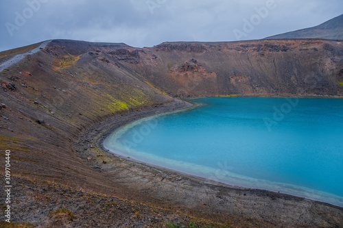 Amazing nature landscape, Viti crater in Krafla caldera, lake with emerald colored water, geothermal volcanic area, northern Iceland, Myvatn region. Scenic panoramic view, outdoor travel background