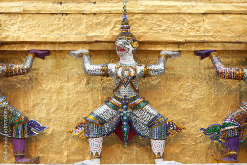 tradition demon statue which support golden chedi