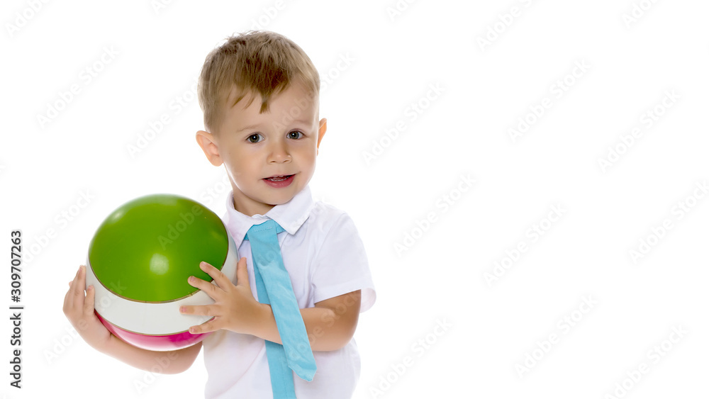 A little boy is playing with a ball. A little boy is playing with a ball.