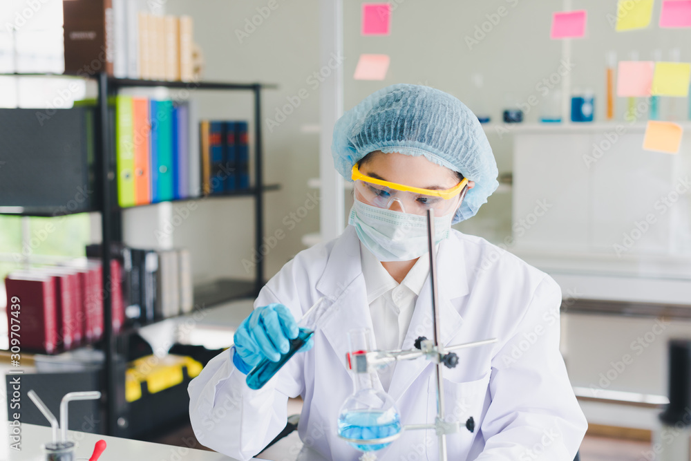 Asian scientists are testing and analyzing many chemicals in the lab. Science and Chemical Concepts. Asian scientists are testing and analyzing many chemicals in the lab. Science and Chemical Concepts.