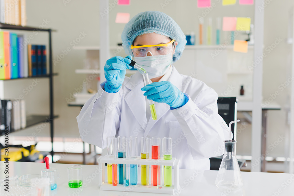 Asian scientists are testing and analyzing many chemicals in the lab. Science and Chemical Concepts. Asian scientists are testing and analyzing many chemicals in the lab. Science and Chemical Concepts.