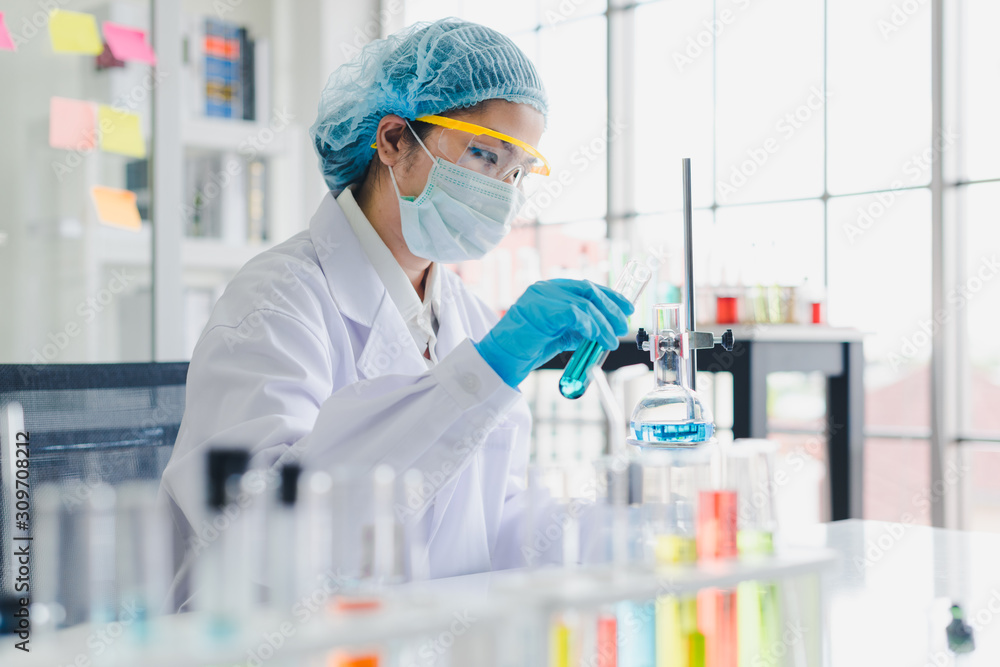 Asian scientists are testing and analyzing many chemicals in the lab. Science and Chemical Concepts. Asian scientists are testing and analyzing many chemicals in the lab. Science and Chemical Concepts.