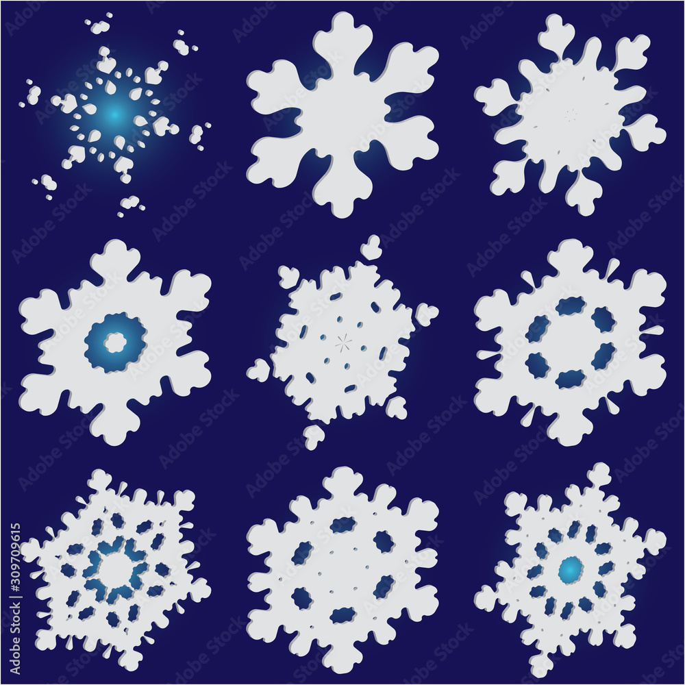 Set of isolated falling snowflakes on blue background. Set of isolated falling snowflakes on blue background.
