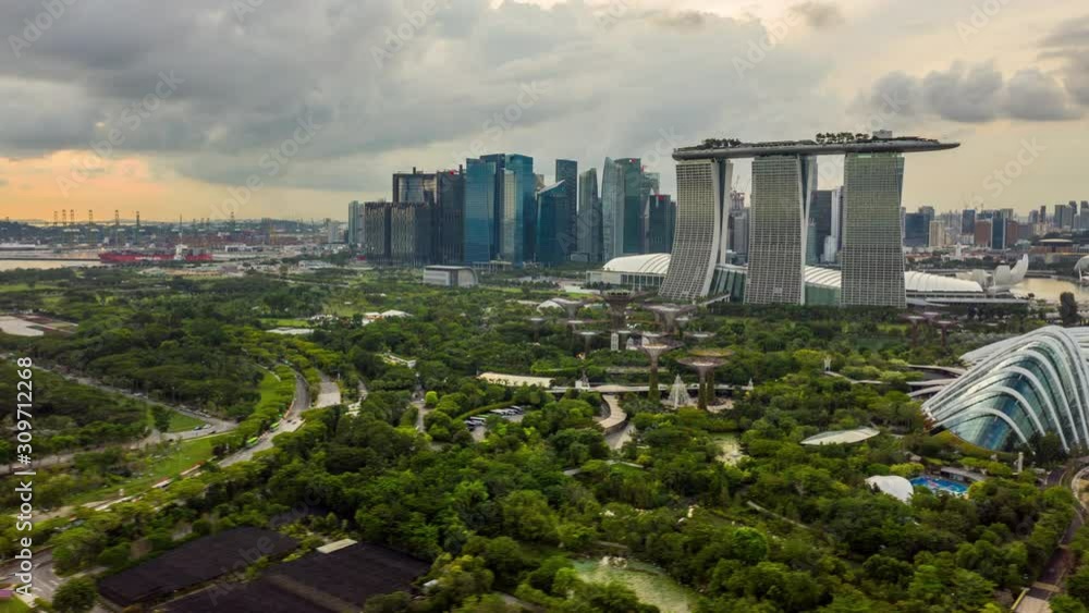 Hyperlapse Drone flight over Gardens by the Bay towards Marina Bay Sands Hotel in Singapore.